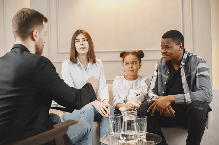 Family participating in a counseling session with a therapist at Mentally Healthy Care in California
