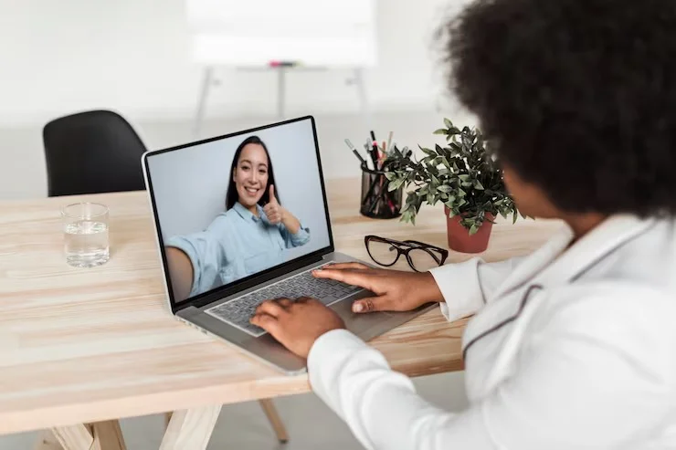 Therapist conducting an online couples therapy session via laptop at Mentally Healthy Care in Long Beach, CA