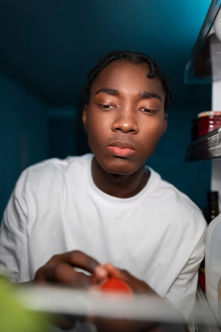 Young adult man reflecting during individual counseling in Long Beach, CA
